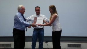 Ben Trachsel being presented First Place by District Statistician Mark Latta and Division B Director Theresa Mickelson for the Humorous Speech Contest.