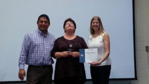 Meg Schneider being presented First Place by District Director Keith Nielsen and Division B Director Theresa Mickelson for the Humorous Speech Contest.