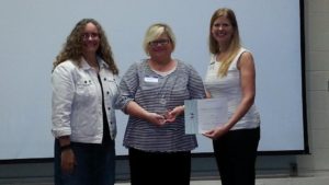 Michele Ortega being presented Second Place by District Parliamentarian Anne Chapman and Division B Director Theresa Mickelson for the Humorous Speech Contest.