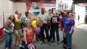 Members of Crossroads Storytellers welcome Kory back from the airport after competing in the World Championship of Public Speaking