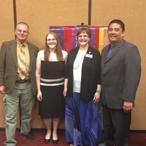 Current District Director Paul Wood with incoming leadership, Brenda Peshak, Jeanne Heil, and Keith Nielsen