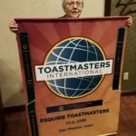 esquire-toastmasters-banner-and-mary-harlan